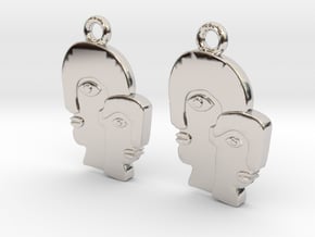 Abstract faces in Rhodium Plated Brass