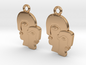 Abstract faces in Polished Bronze