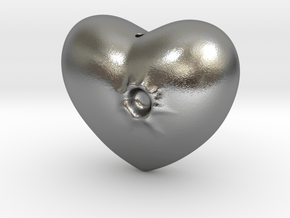 Heart with a bullet hole in Natural Silver