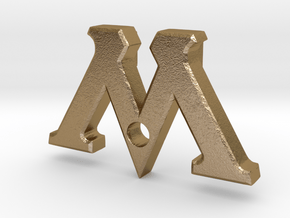 Badge "M" (Film Wizardry) in Polished Gold Steel