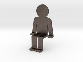 Person sitting in Polished Bronzed Silver Steel