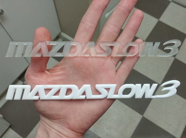 MAZDASLOW3 Emblem in Orange Processed Versatile Plastic
