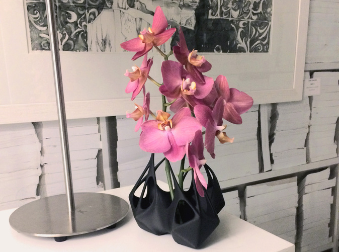 Context image with the vase filled with Orchids
