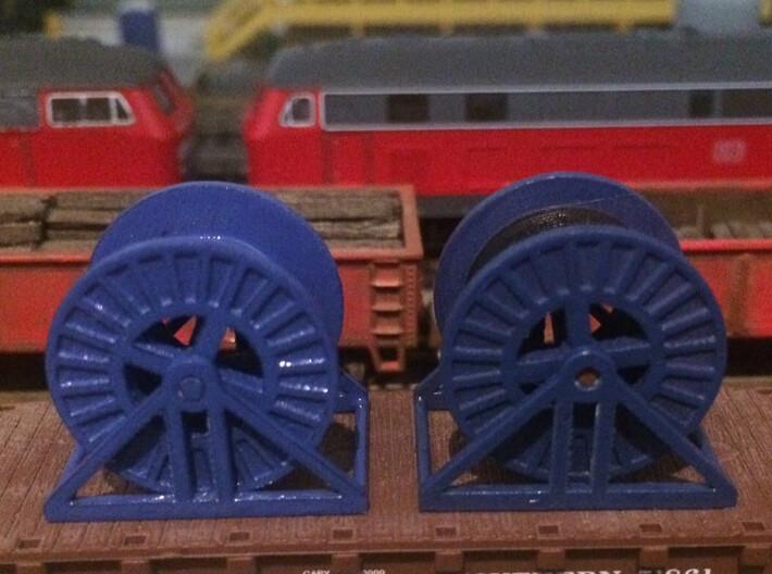 N Scale Steel Cable Reel (Full) 3d printed Steel cable reels in Frosted Ultra Detail, empty on the left and full on the right.