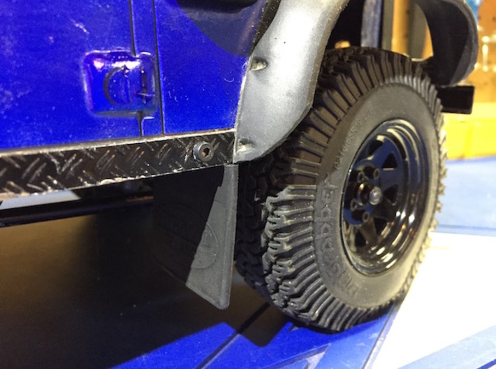 Defender Front Mud Flap Mounts 3d printed Final result with slightly modified mud flap to fit body.