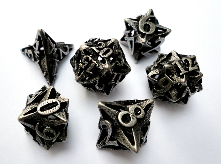 Pinwheel Dice Set 3d printed In stainless steel and inked.