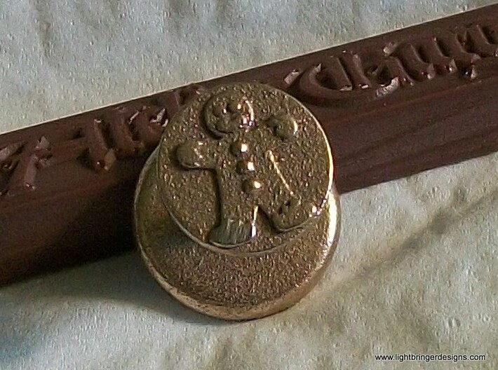 Gingerbread Man Wax Seal 3d printed Gingerbread Man Wax Seal in Stainless Steel, shown with a stick of Gingerbread Brown sealing wax
