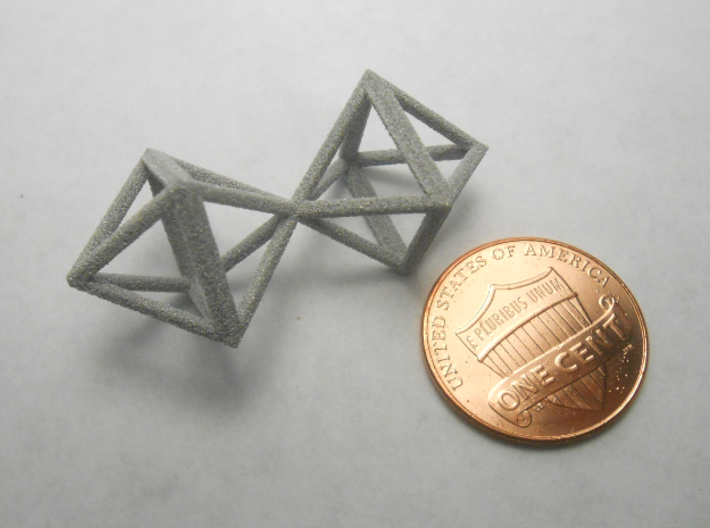 Faceted Twin Octahedron Frame Pendant Small 3d printed Coin scale.