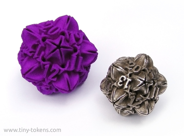 Floral 2 - D20 balanced gaming die 3d printed An example of the size difference between the plastic and metal version. (Please not that the dice shown are the spindown variants.)