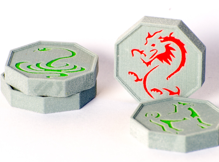 Jackie Chan Talismans (Tiger in Halves) 3d printed A photograph of four of the talismans. Pictures are the Snake, dragon and dog. The texture is much subtler on the actual models.