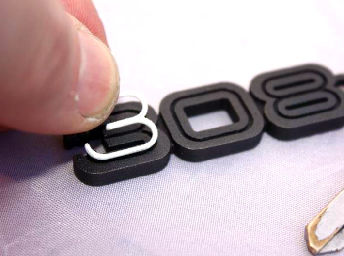 KEYRING LOGO 308 BLACK W INSERTS 3d printed White plastic inserts