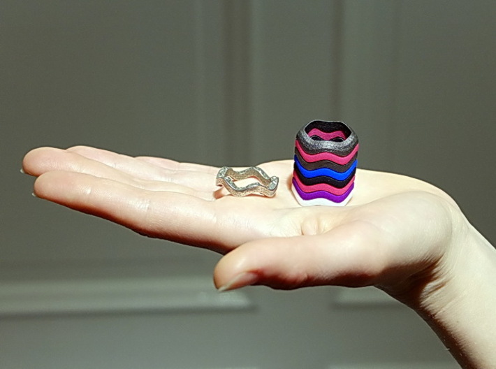 "Hitten Hearts " two or more parts fits together 3d printed you can build a tower to your finger