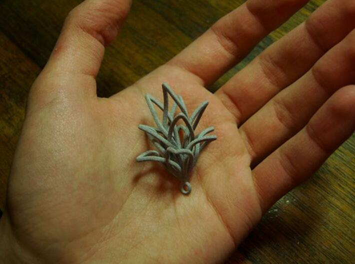 Spiral Flower with loop 3d printed In hand 2