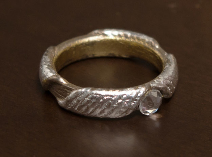 Ring T1A 3d printed Steel with leaf silver on outside bands, leaf gold on the inside, and a crystal