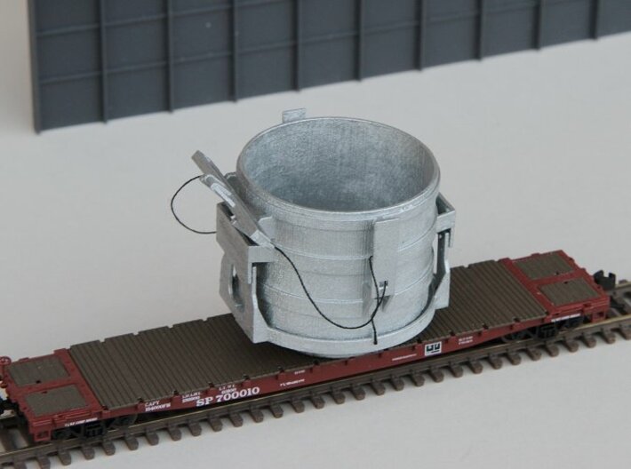 N-scale 16 ft Scrap Bucket 3d printed N-scale 16 ft Scrap Bucket assembled with bottom doors closed. Flat car shown for size reference.