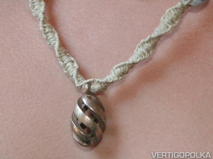 Spiral Spheroid Pendant 3d printed Spiral Spheroid Pendant (shown on handmade jute necklace)