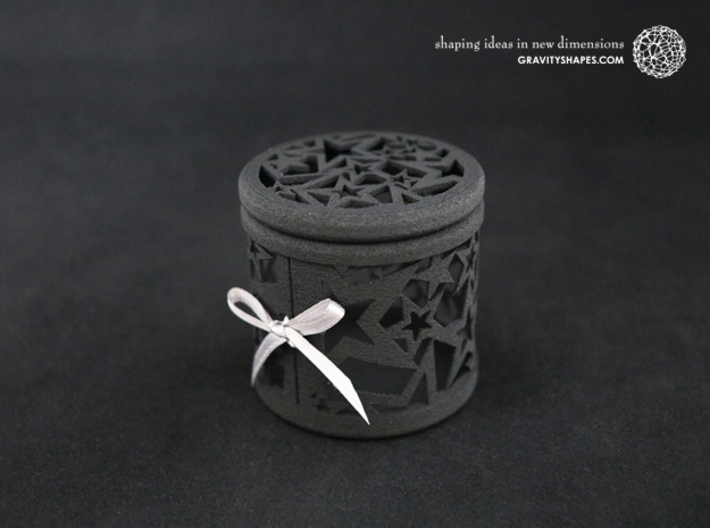 Gift Box No. 1 with Stars (filigree, high) 3d printed The photo shows a print made of black strong and flexible incl. silver lacing.