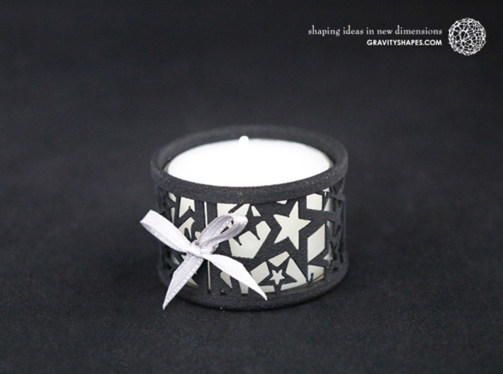 Small tealight holder with Stars 3d printed The photo shows a print made of black strong and flexible incl. silver lacing and a high 8h tealight candle.