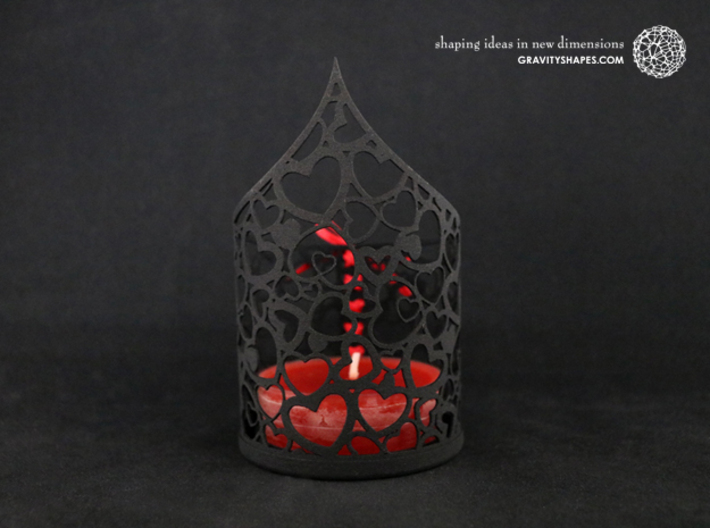 Pointed tealight holder with hearts 3d printed The photo shows prints made of black strong and flexible incl. red lacing.