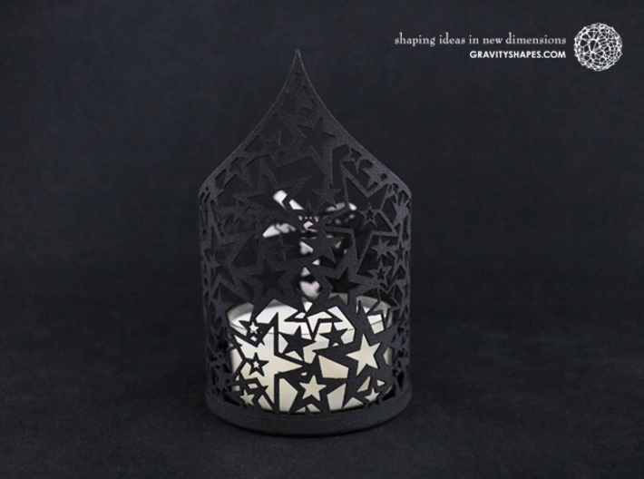 Christmas tealight holder with stars 3d printed The photo shows a print made of black strong and flexible incl. silver lacing.