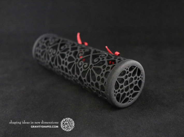 Filigree Gift roll XXL-size with Mosaic-3 (14 cm) 3d printed The photo shows a print made of black strong and flexible incl. red lacing.