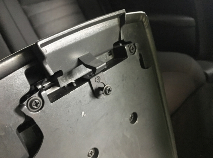 Dodge Challenger Armrest repair - Latch spring 3d printed To install, simply remove this screw, slide the part in place and put back the screw.