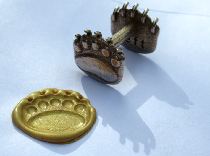 Teddybear clawed-paw wax seal 3d printed golden wax from a wicked stick of sealing wax