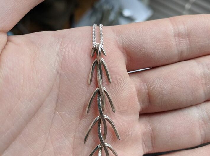 Douglas Fir Necklace 3d printed An image of the back show the chain ring, front looks identical. 
