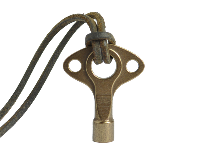 Drum Key - Wearable & Functional by SCAD Design 3d printed Polished Bronze & 3mm Leather Cord.