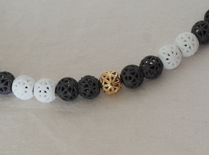 torus_pearl_loop_type4_thick 3d printed Dark Gray PA12 Glass Beads, White Natural Versatile Plastic and Polished Brass