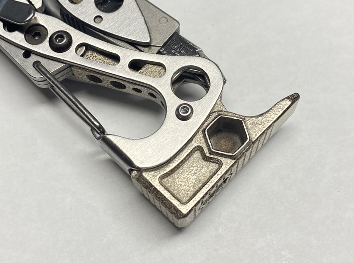 Leatherman Skeletool Hammer/Jammer 3d printed A rotary tool was used to carefully widen the hole to access the 1/4&quot; hex driver feature