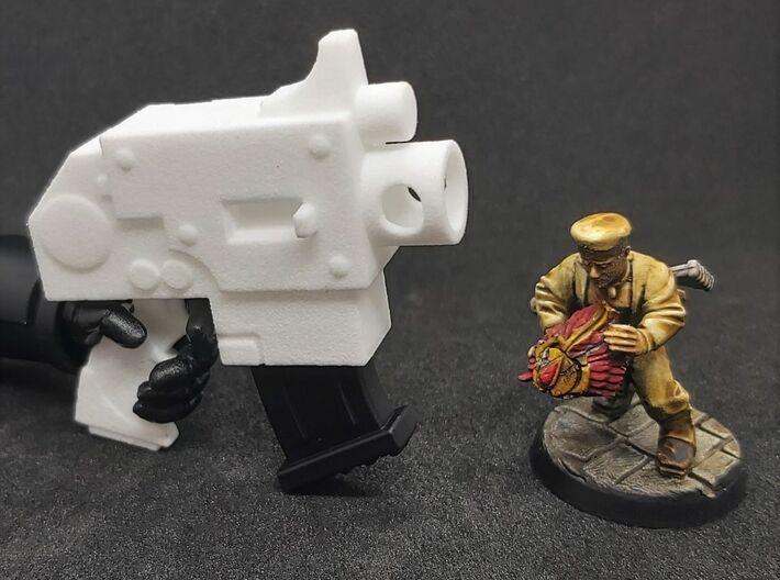 Action Figure Bolt Pistol 3d printed Printed in White Processed Versatile Plastic, shown with the magazine from a 1:12th scale action figure and a 28mm heroic scale model
