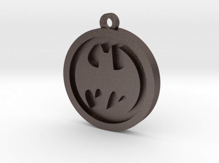 Batman Pendant 3d printed : A bronze steel alloy, plated with a thin coating of a silver bronze mixture, then polished until shiny and smooth. Increase wearability and longevity by using a protective coating like Nickel Guard, Jewelry Shield, or even clear nail polish
