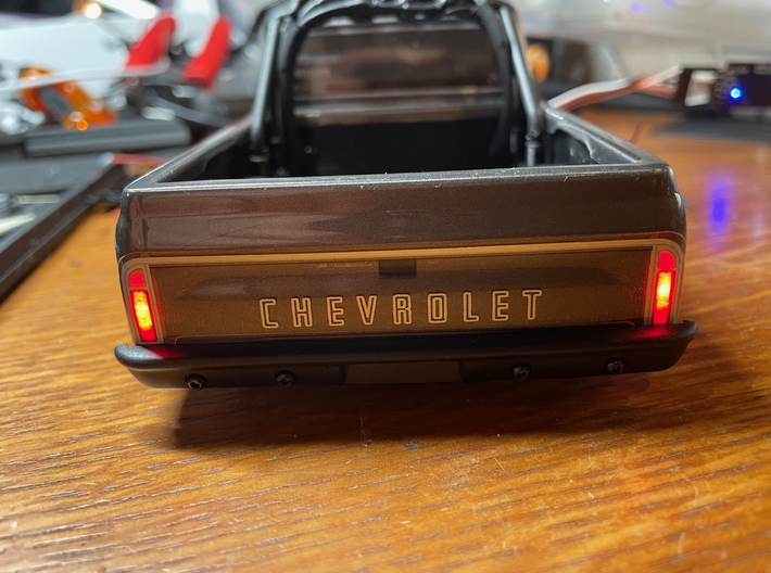SCX24 C10 Taillight Buckets 3d printed Brake lights on - Using a light controller, the brightness of the taillights can be controlled