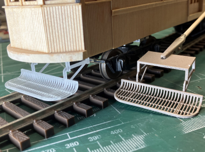 O-scale 1/48 Lake Shore Electric LSE fender 3d printed raw part preview, and also a primed one
