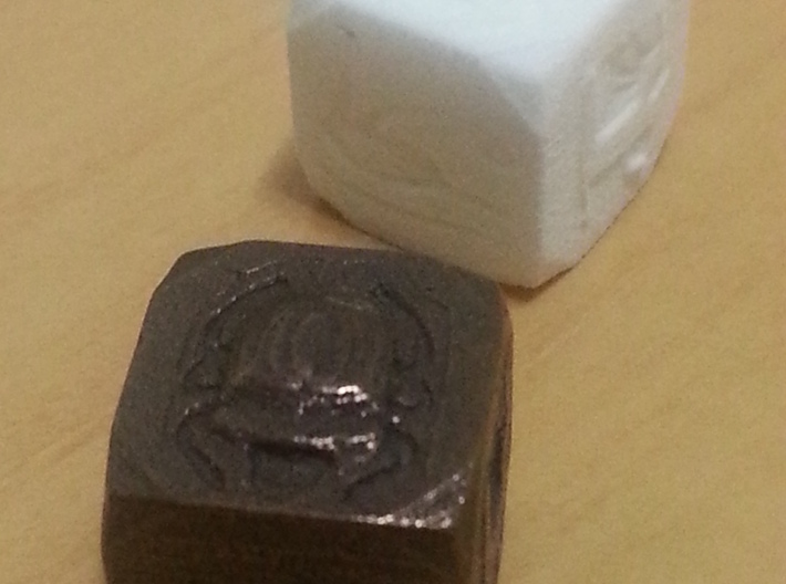 Egyptian Themed Die 3d printed White Strong Flexible and Polished Bronze Steel