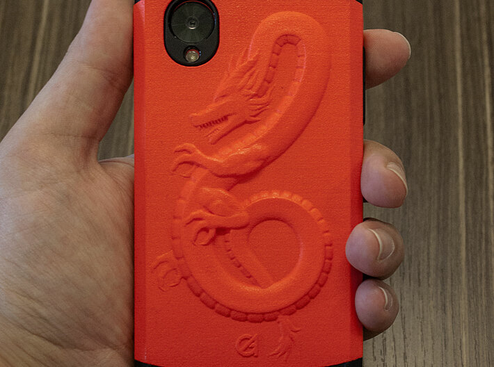 Dragon Phone Case FINAL 3d printed The unpolished white plastic case, after it has been painted with Liquitex Fluorescent Red and sealed with a satin finish. This mix almost exactly matches the colour of my Red Nexus 5 phone underneath.  