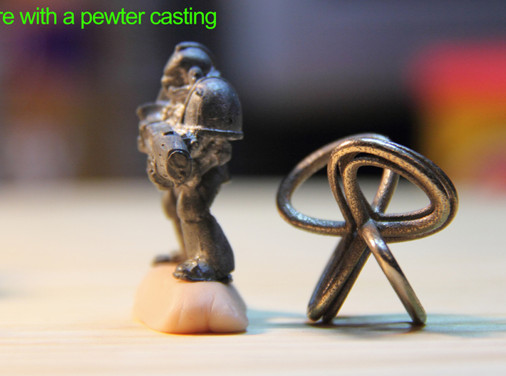 1 Inch Cut Mobius 3d printed The pewter casting has a seam, the 3D print does not..