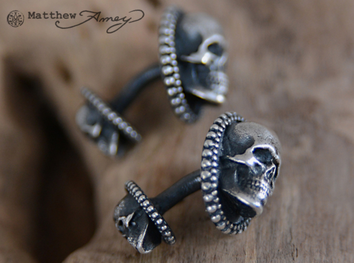 Skull cuff link - 25mm 3d printed Raw silver that I applied a patina to. I then hand-polished off the patina.