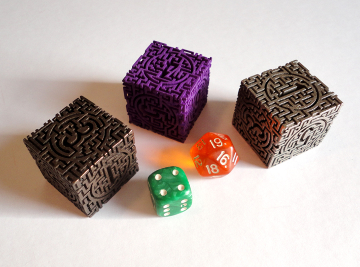 Labyrinthine d6 3d printed A size comparison of the die in polished bronze steel, purple strong and flexible, and stainless steel with normal dice