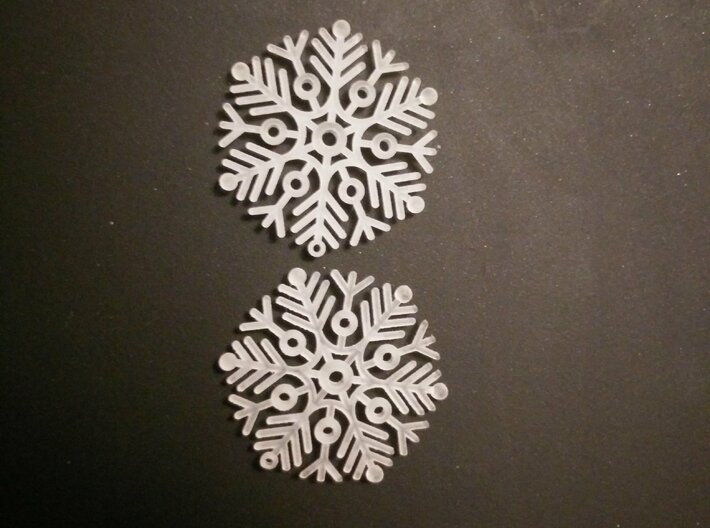 Snowflake Earrings 2 3d printed Printed with a different design, same material.