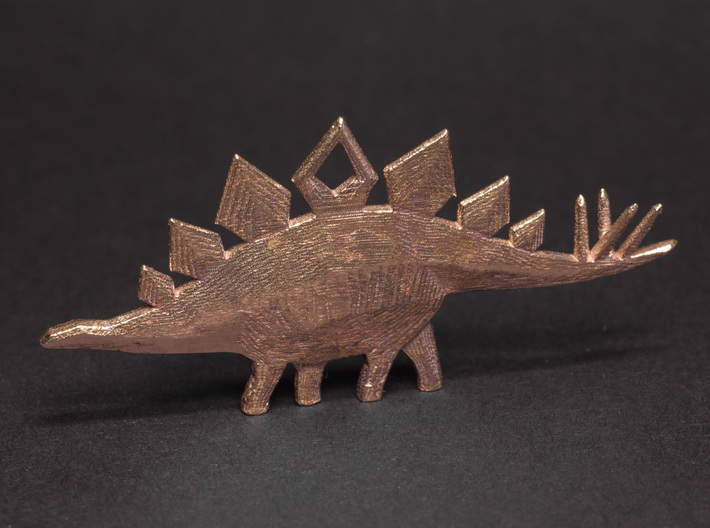 Stegosaurus Pendant 3d printed Shown in Raw Bronze