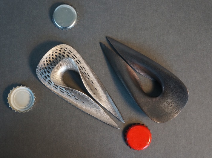 Splendor Solis - Bottle Opener - solid version 3d printed Right: Polished Grey (solid version). Left: Polished Nickel ( version with perforated pattern )