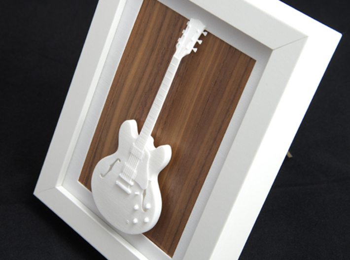 Gibson ES 335 guitar for photo frame 3d printed Frames and background pictures are not included!!Gibson ES 335 in a white frame with wood background 