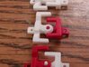 HO articulated joints for Walthers 48' spine car 3d printed red pieces are original plastic