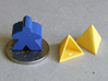 Tetrahedron Capstones (x20) 3d printed Showing scale with ten pence coin and meeple. Also shows the sprue cut-off point inside the capstone.