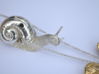 Descending Snail Pendant, part 1 3d printed Polished silver snail with gold plated brass leaf (photo)