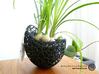 A burgeoning capsule Planter with large Pot 3d printed Picture shows the 2-part version (black Plastic/PLA). But the shape is the same.