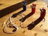 Kitty Cat Earbud Storage Case 3d printed Three Bud-Es come upon a tangled cord...