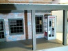 Telephone Booth, 1/32 Scale 3d printed Phone booth on front porch of 1/32 scale model building.
